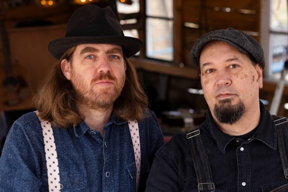 Gabriel and João looking serious.